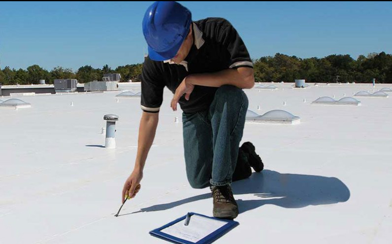 Professional flat roof installation on commercial building