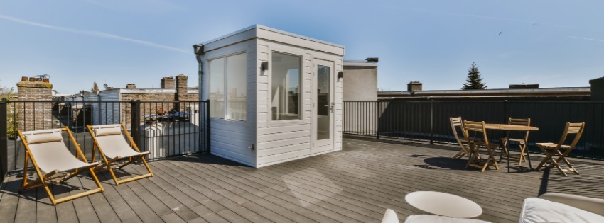 Modern rooftop deck with city view and outdoor living space